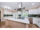Bright kitchen featuring a large island, stainless steel appliances, and plenty of natural light at 10600 Indian Hills Ct, Seminole, FL 33777
