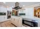 Gourmet kitchen with stainless steel appliances and large kitchen island at 10600 Indian Hills Ct, Seminole, FL 33777