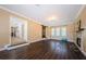Comfortable living room boasting wood floors, a fireplace, and plenty of natural light at 10600 Indian Hills Ct, Seminole, FL 33777