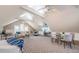 Spacious living room with vaulted ceilings, ceiling fans, and versatile layout with seating and dining areas at 10600 Indian Hills Ct, Seminole, FL 33777