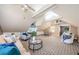 Bright living room with vaulted ceilings, ceiling fans, and versatile layout with seating and dining areas at 10600 Indian Hills Ct, Seminole, FL 33777
