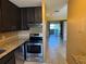 Kitchen and living room with tile flooring at 11432 Bay Ne St # 11432, St Petersburg, FL 33716