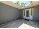 Inviting front entryway featuring a tiled patio and a stylish white front door with glass detailing at 12536 116Th St, Largo, FL 33778