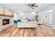 Bright living room with wood floors, a stone fireplace, vaulted ceilings, and a large window for natural light at 12536 116Th St, Largo, FL 33778