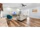Bright living room with hardwood floors, vaulted ceilings, and a stone fireplace for a cozy atmosphere at 12536 116Th St, Largo, FL 33778