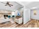 Comfortable living room boasts a stone fireplace, vaulted ceilings, and a modern aesthetic with stylish furniture at 12536 116Th St, Largo, FL 33778