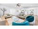 Spacious open concept living room with wood floors, vaulted ceilings, and access to kitchen and dining area at 12536 116Th St, Largo, FL 33778