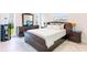 Bedroom with neutral color palette and large window overlooking the water at 13797 Pinecrest Dr, Largo, FL 33774