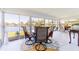 Sunroom with a view of the lake and round dining table at 13797 Pinecrest Dr, Largo, FL 33774