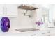 Stylish kitchen features stainless steel appliances, sleek white cabinets, and a modern cooktop for culinary enthusiasts at 13797 Pinecrest Dr, Largo, FL 33774