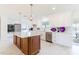 Bright kitchen features a large island, stainless steel appliances, and stylish pendant lighting at 13797 Pinecrest Dr, Largo, FL 33774