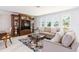 Cozy living room features ample natural light, comfortable seating, and stylish decor, perfect for relaxation at 13797 Pinecrest Dr, Largo, FL 33774