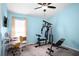 Bedroom featuring home gym equipment, desk, and ceiling fan providing space for both fitness and work at 1418 Hurley Pond Ln, Valrico, FL 33596