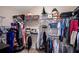 Walk-in closet with shelving, hanging rods, and ample storage space for organized wardrobe and accessory display at 1418 Hurley Pond Ln, Valrico, FL 33596
