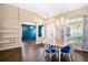 Elegant dining room featuring stylish chairs, modern lighting, and large windows at 1418 Hurley Pond Ln, Valrico, FL 33596
