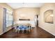 Elegant dining room featuring stylish chairs, modern lighting, and large windows at 1418 Hurley Pond Ln, Valrico, FL 33596