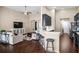 Open-concept living area with bar seating and seamless flow to the kitchen and seating at 1418 Hurley Pond Ln, Valrico, FL 33596