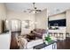 Inviting living room seamlessly connects to the kitchen and dining area, perfect for modern living at 1418 Hurley Pond Ln, Valrico, FL 33596