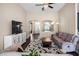 Spacious living room includes a comfortable sofa, decorative TV stand, and an open layout for easy living at 1418 Hurley Pond Ln, Valrico, FL 33596