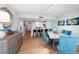 Dining room features light wood flooring, a modern sideboard, and a table with seating for six at 15462 Gulf Blvd # 904, Madeira Beach, FL 33708