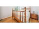 Bedroom with a full-sized wood bed frame and wood floors, plus a wood nightstand at 15930 Sorawater Dr, Lithia, FL 33547