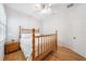 A bright bedroom featuring light bamboo floors and a wooden four poster bed at 15930 Sorawater Dr, Lithia, FL 33547
