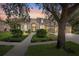 Charming single-story home featuring manicured landscaping and a welcoming front entrance at sunset at 15930 Sorawater Dr, Lithia, FL 33547