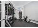This home gym includes complete weight training equipment and rubber flooring for a great work out space at 15930 Sorawater Dr, Lithia, FL 33547