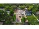 Aerial view showcases the property with gazebo, outdoor kitchen, putting green, and landscaped backyard at 1600 E Hanna Ave, Tampa, FL 33610