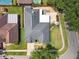 Aerial view of a home with a spacious backyard, well-maintained lawn, and a neatly arranged layout at 16608 Meadow Cove St, Tampa, FL 33624