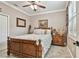 Bedroom features a bamboo-style bed, neutral walls, and natural light from the windows at 16608 Meadow Cove St, Tampa, FL 33624