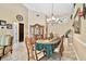 Elegant dining room featuring a chandelier, decorative accents, and a table set for a formal meal at 16608 Meadow Cove St, Tampa, FL 33624