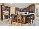 Spacious kitchen boasts a large island, breakfast bar, and ample cabinet storage at 16608 Meadow Cove St, Tampa, FL 33624
