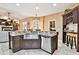 Bright kitchen featuring a farmhouse sink, stainless steel appliances, and granite countertops at 16608 Meadow Cove St, Tampa, FL 33624