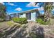 Well-maintained home with a beautiful backyard, lush landscaping, and an enclosed pool at 17364 Mediterranean Cir, Weeki Wachee, FL 34614