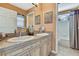 Spacious bathroom featuring double sink vanity and a separate toilet and shower area at 17364 Mediterranean Cir, Weeki Wachee, FL 34614