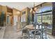 Cozy dining area boasting a chandelier, a large window, and stylish décor at 17364 Mediterranean Cir, Weeki Wachee, FL 34614