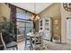 Charming dining area features a chandelier, a large window, and stylish decor at 17364 Mediterranean Cir, Weeki Wachee, FL 34614