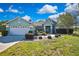 Charming single-story home with a well-manicured lawn and lovely landscaping at 17364 Mediterranean Cir, Weeki Wachee, FL 34614