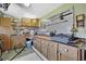 Functional garage space with wooden cabinets, work area and pegboard for tool organization at 17364 Mediterranean Cir, Weeki Wachee, FL 34614