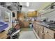 Organized garage with abundant storage cabinets and ample space for projects and equipment at 17364 Mediterranean Cir, Weeki Wachee, FL 34614