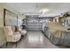 Clean and tidy garage featuring seating, covered car, and overhead door at 17364 Mediterranean Cir, Weeki Wachee, FL 34614