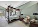Spacious main bedroom features a canopy bed and a ceiling fan at 17364 Mediterranean Cir, Weeki Wachee, FL 34614