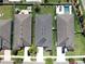 Straight down aerial of well-kept home with tidy yard in a suburban neighborhood with manicured lawn at 17740 Bright Wheat Dr, Lithia, FL 33547