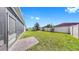 A fully fenced backyard offers a private outdoor space, with ample lawn area at 17740 Bright Wheat Dr, Lithia, FL 33547