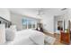 Serene bedroom features bright windows, wood floors, comfortable seating and ample natural light at 17740 Bright Wheat Dr, Lithia, FL 33547