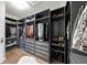 Well-organized walk-in closet featuring custom shelving, drawers, and ample storage for clothes and shoes at 17740 Bright Wheat Dr, Lithia, FL 33547