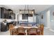 Bright kitchen features granite counters, stainless appliances, an island, and modern pendant lighting at 17740 Bright Wheat Dr, Lithia, FL 33547
