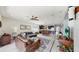 The living room boasts ample natural light, seamlessly connecting the kitchen and dining areas at 17740 Bright Wheat Dr, Lithia, FL 33547