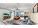 Beautiful living room with natural light from sliding glass doors and features a cozy seating area at 17740 Bright Wheat Dr, Lithia, FL 33547